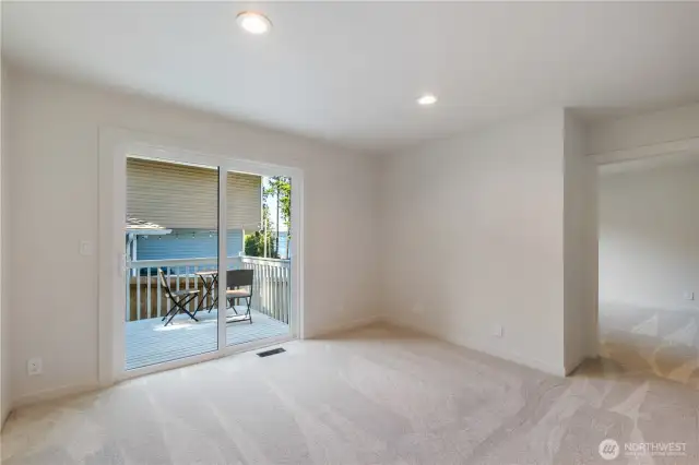 Bonus room with private deck, perfectly located between bedroom 2 & 3 on the lower level.