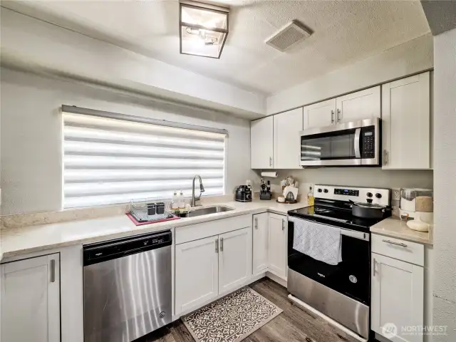 Open kitchen with access to living and dining areas
