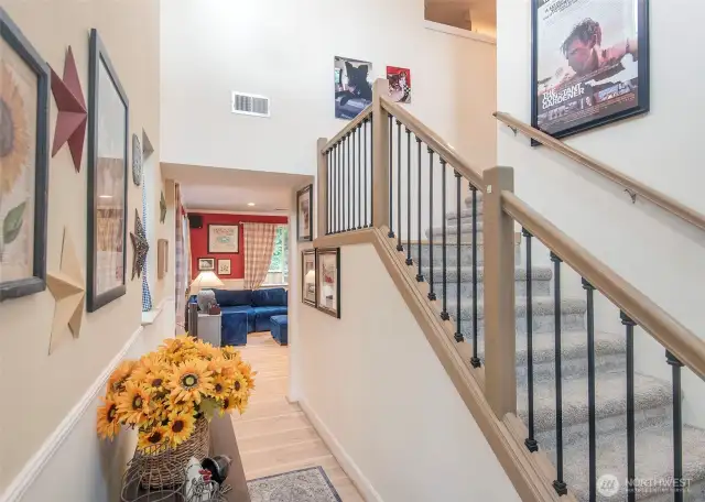 Vaulted ceilings greet you along with this gorgeous and reinforced bannister.