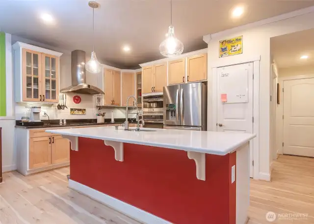 Updated island kitchen with newer appliances.