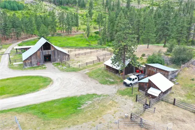 Aerial of outbuildings including barn, workshop, storage, and livestock shelters