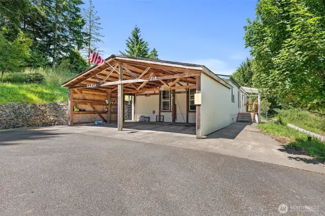 Enjoy easy access and sheltered parking with a spacious double carport—ideal for Northwest weather.