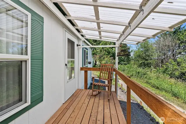 A welcoming covered front porch offers a charming spot to greet guests or enjoy a quiet moment.