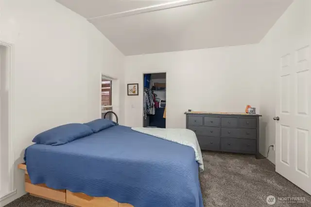 Comfortable and private primary suite with peaceful soft natural light defused by the carport.