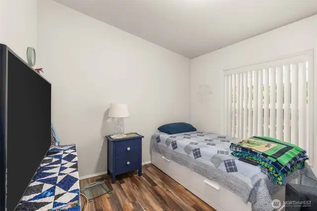 This comfortable room offers the flexibility to serve as a quiet office or welcoming guest space.