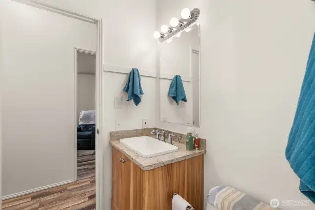 Smartly designed bathroom with access from both laundry and main living areas—ideal for busy households.
