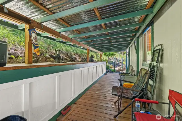Spacious covered deck right off the back door—ideal for year-round outdoor living. The perfect place to sit in the afternoon and enjoy a summer breeze.