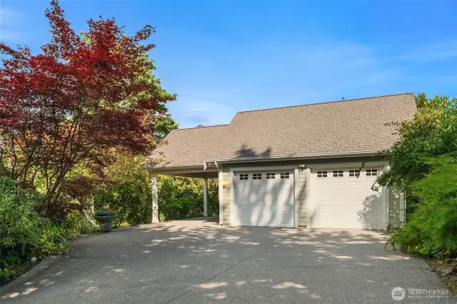 Garage with attached carport also has heat and a bathroom. Lots of additional parking for RV's, boats and friends.