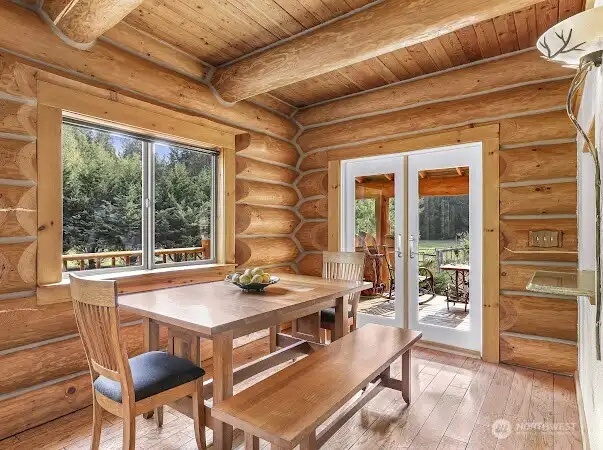 French doors lead to the wrap around deck