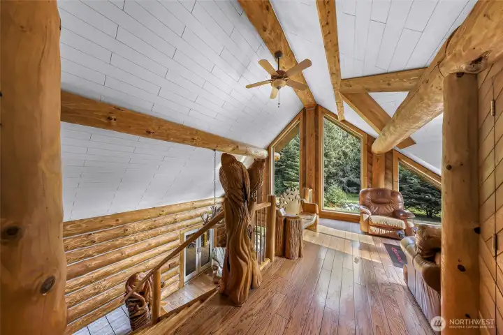 Custom Owl carvings great you as you enter the loft