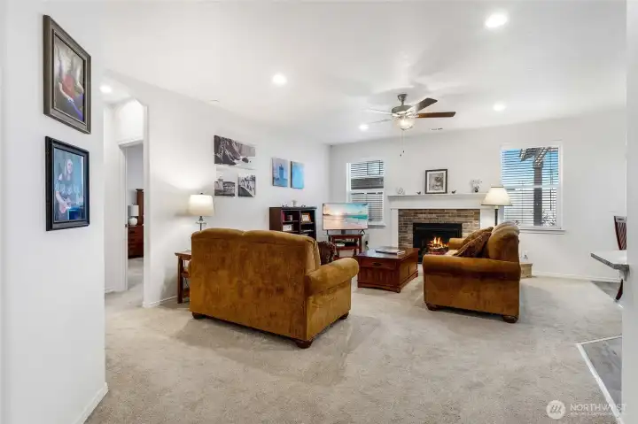 The living room has a great amount of space for everyone to gather, and the primary bedroom is off to the left of the sofa.