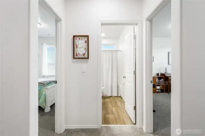 Back toward the front of the house we have the two other bedrooms, where the one on the left is used as a guest bedroom, and the one on the right, which is being used as a piano studio.