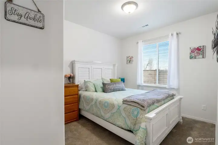 Enter the guest bedroom and check out all of the floor space, even with a queen size bed in there.