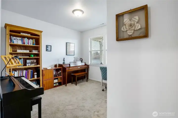 Bedroom #3 is being used as a piano studio currently. This room is currently at the front of the home.