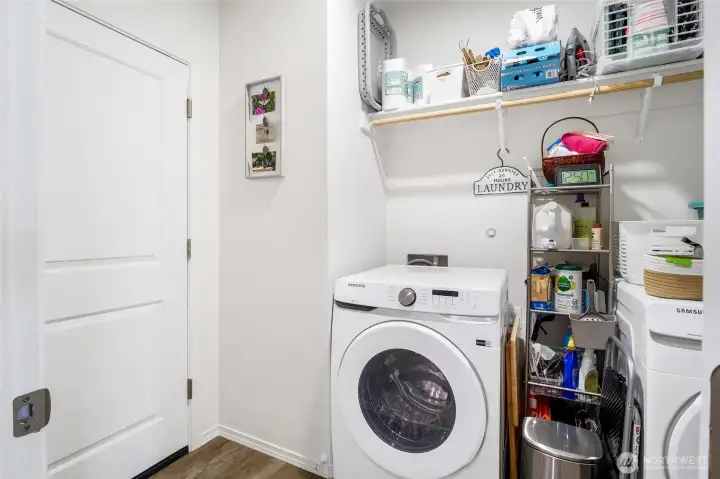 The laundry room is the perfect place to toss dirty clothes as you're heading into the garage to go to work!