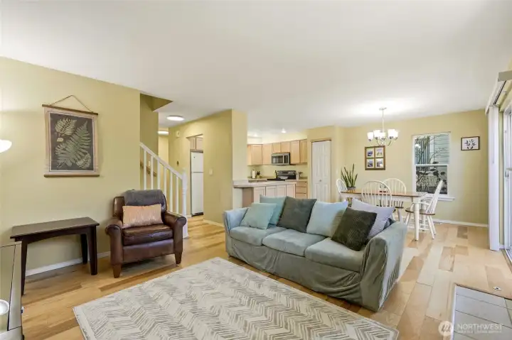 Open floor plan with living, dining, and kitchen areas.