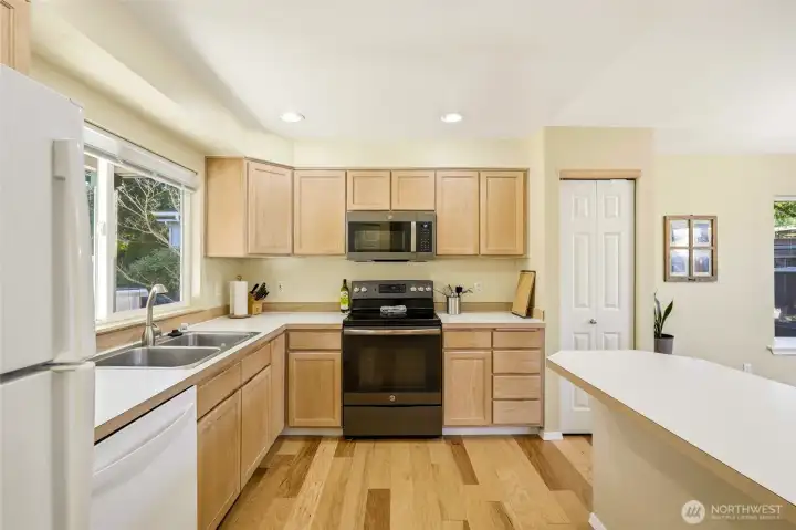 Kitchen with peninsula and stainless appliances.