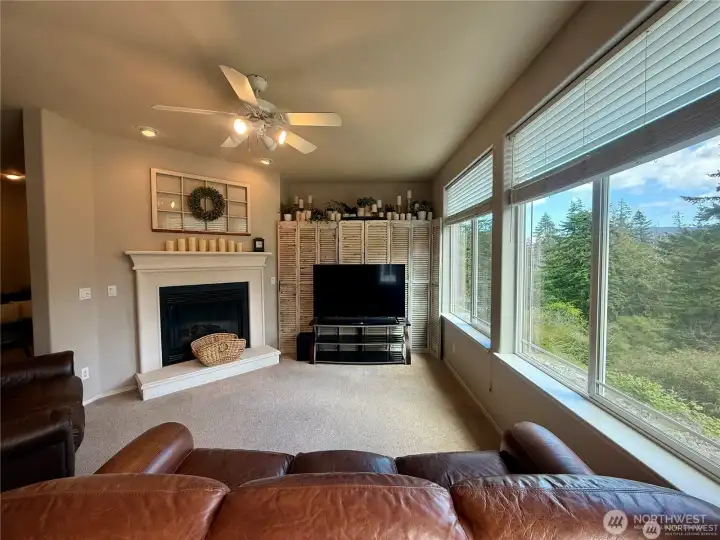 Gather around the fireplace in the family room just off the kitchen.