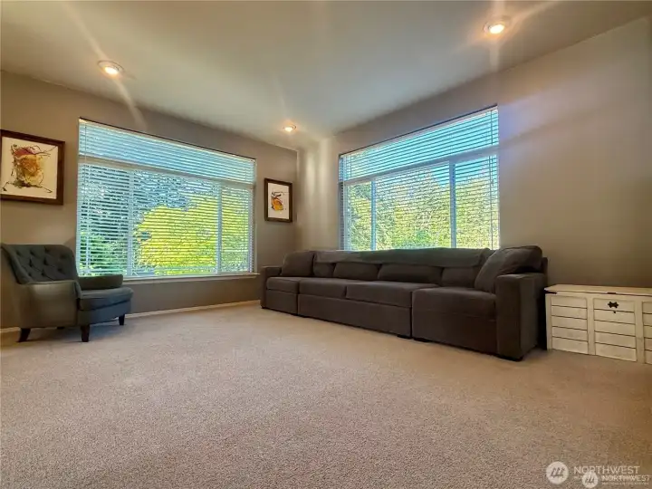 Generously sized living room with massive picture windows overlooking the ponds, gazebo and watefall.