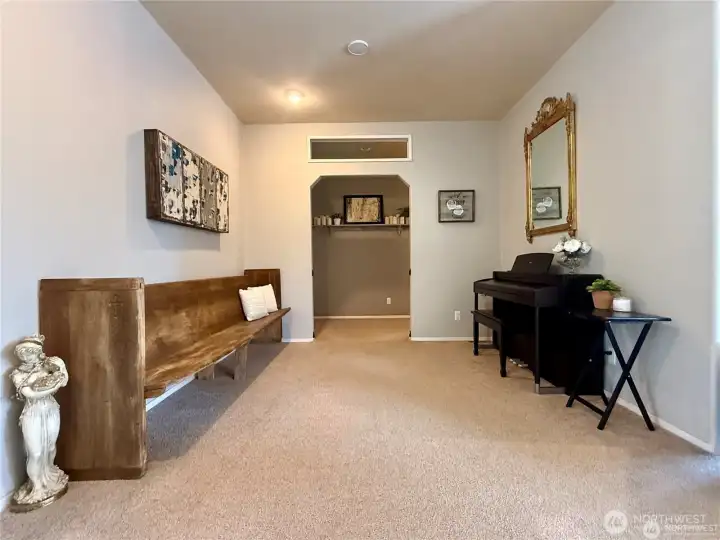 Bonus space between living room and family room serves as additional gathering space and music room.