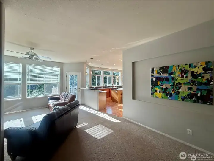 A tranquil color palette throughout the home and massive picture windows brings a sense of peace and a light airiness to the homes interior.