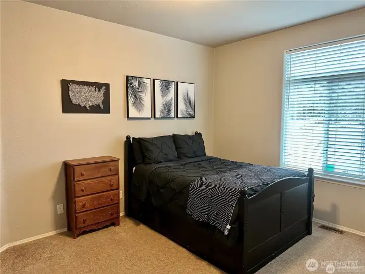 Bedroom three with large picture windows.