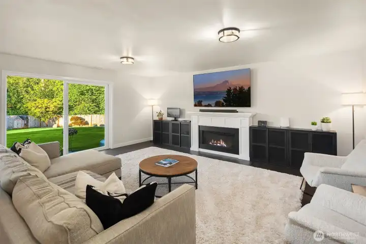 The living room is just steps from the entertainers kitchen and features an electric fireplace that can be used to create heated or unheated ambiance.