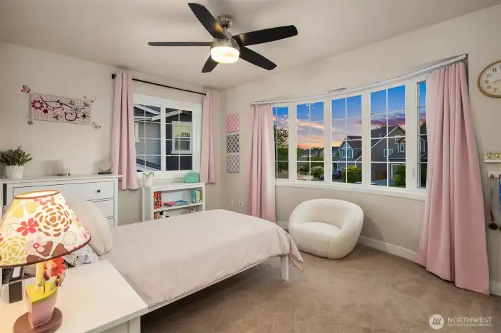 Amply sized bedrooms offer generous closet space and custom windows.