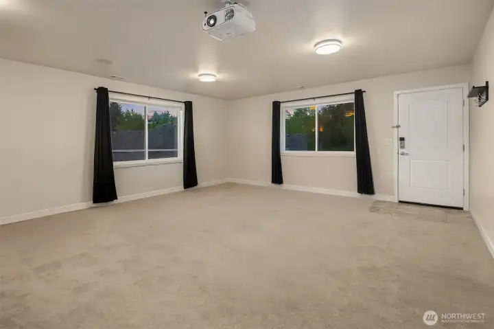 On the opposite side of the theater room you have plenty of additional space for an in home gym, art studio, play room, or perhaps turn this space into it's own secondary living suite with private access -- great opportunity for Mother-in-law or multi-generational living