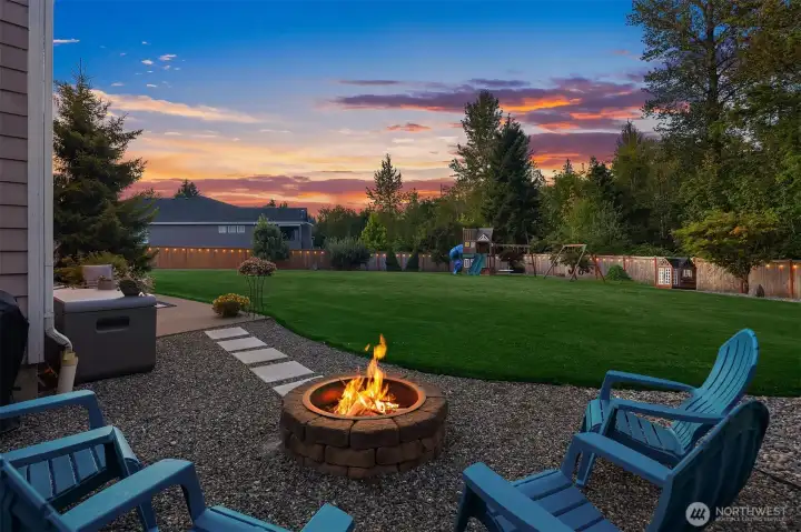 Enjoy an evening fire overlooking the meticulously manicured lawns and landscaping with the wooded Fennel Creek Train stretching off into the distance.