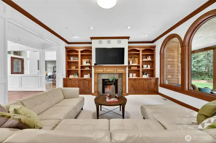 The Family Room open to Kitchen and casual dining area. Arched Windows frame your private wonderland