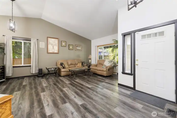 Front living room with vaulted ceilings and new LVP