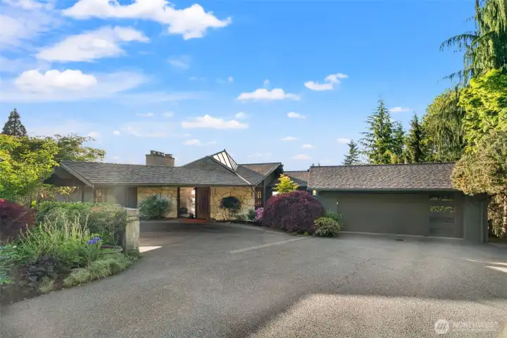 Two car garage plus an additional 2 car garage around the back of the home.