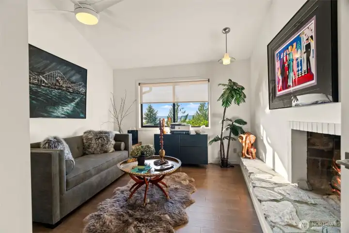 Flexible space with a fireplace. Perfect for a gathering space or den.