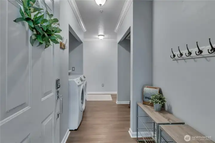 Entryway with in-unit full-size washer and dryer and coat storage Entryway with in-unit full-size washer and dryer and coat storage