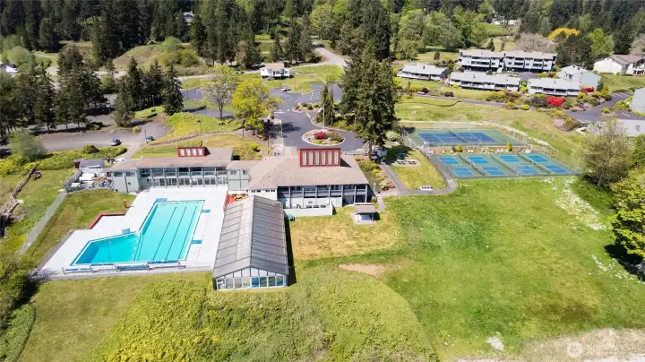 Aerial View of Beach Club. Indoor/Outdoor pools. Gym, Pickleball Courts and a full Kitchen and Event space.
