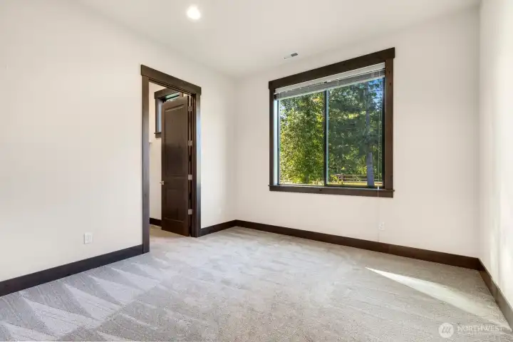 One of four bedrooms on main floor-note walk in closet One of four bedrooms on main floor-note walk in closet
