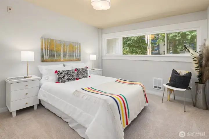 Large bedroom with new carpet.