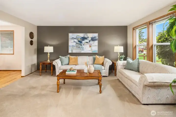 Located to the right of the foyer is this spacious living room with wood-burning fireplace. Located to the right of the foyer is this spacious living room with wood-burning fireplace.
