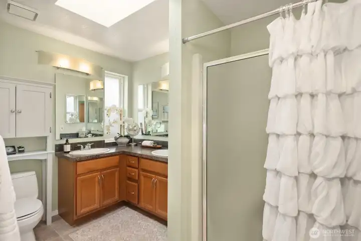 The primary bath features a shower and dual sinks. The primary bath features a shower and dual sinks.