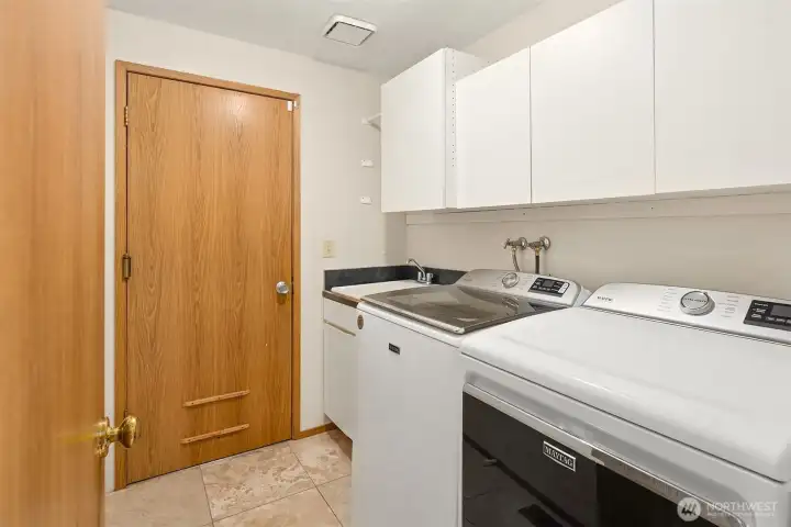 Washer and dryer are included; the door you see leads to the 2-car garage. Washer and dryer are included; the door you see leads to the 2-car garage.