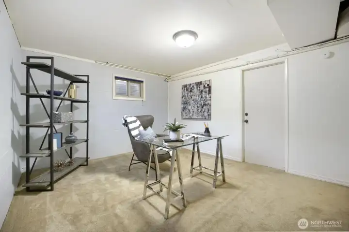 Flexible Office or Creative Space This bright, functional room offers the perfect setup for a home office, studio, or quiet retreat. Neutral finishes and soft carpeting create a comfortable environment, while the window provides natural light for an inviting workspace. With ample wall space and room for shelving or storage, this area is ideal for productivity or relaxation within the home. Flexible Office or Creative Space This bright, functional room offers the perfect setup for a home office, studio, or quiet retreat. Neutral finishes and soft carpeting create a comfortable environment, while the window provides natural light for an inviting workspace. With ample wall space and room for shelving or storage, this area is ideal for productivity or relaxation within the home.