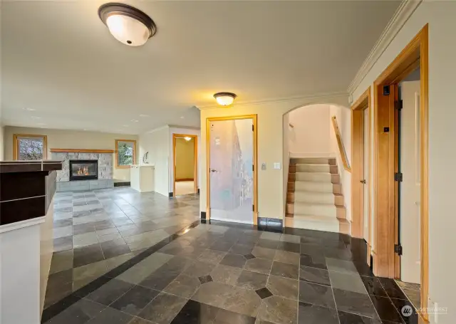 Another view of the lower level family room. The elevator is located behind the door to the left of the stairs.