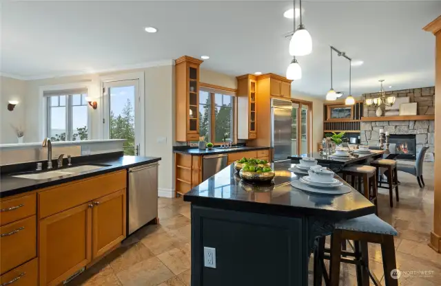 Chef's dream kitchen with two islands, two sinks and dishwashers, commercial grade range.