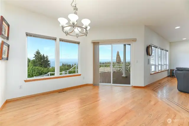 previous owner had a large dinning room table in this area between living room and kitchen. Slider opens to large multi-level deck