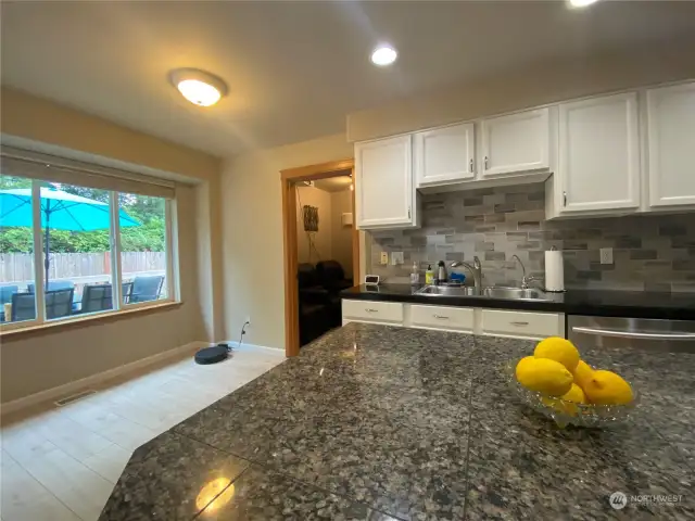 Granite counter top shines throughout the kitchen