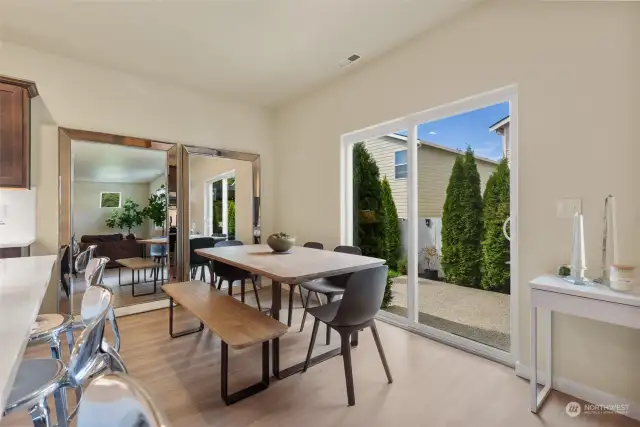 The spacious dining area features a sleek slider that opens to a large patio, perfect for seamless indoor-outdoor entertaining. Whether you're hosting large holiday gatherings or casual get-togethers, this home offers plenty of room for all your events and celebrations. Enjoy the bright, open layout and beautiful garden views, making this the perfect space for creating lasting memories with family and friends.