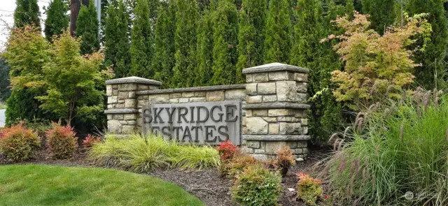 Welcome to Skyridge Estates, where coming home feels like an escape to nature. The tree-lined entrance, framed by lush greenery and an elegant stone monument, creates an inviting and serene atmosphere the moment you arrive. As you drive through, the beautiful landscaping and towering evergreens provide a sense of tranquility, setting the tone for peaceful living in this well-maintained community. Skyridge Estates offers not only a welcoming entrance but also a lifestyle of comfort and beauty, making it the perfect place to call home.            Welcome to Skyridge Estates, where coming home feels like an escape to nature. The tree-lined entrance, framed by lush greenery and an elegant stone monument, creates an inviting and serene atmosphere the moment you arrive. As you drive through, the beautiful landscaping and towering evergreens provide a sense of tranquility, setting the tone for peaceful living in this well-maintained community. Skyridge Estates offers not only a welcoming entr