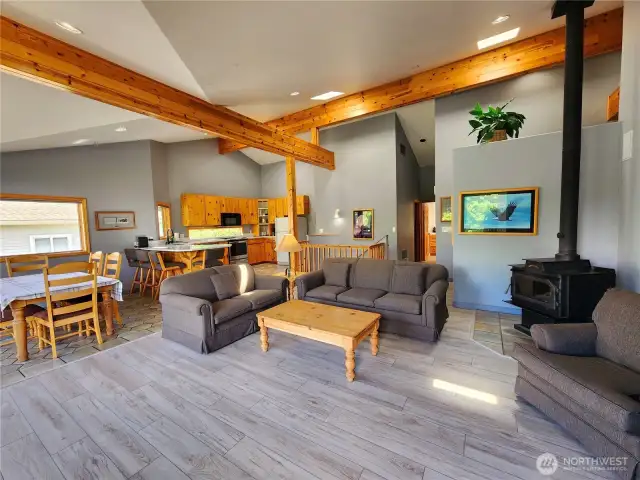 Walk in the front door to vaulted ceilings, new vinyl flooring, natural wood accents.