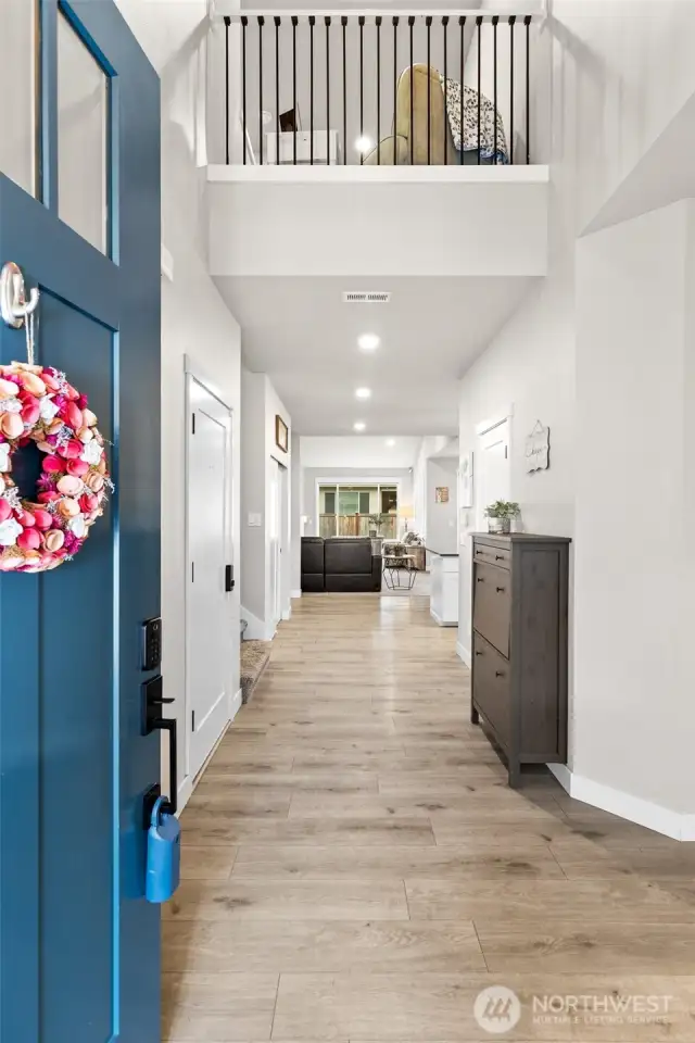 Welcome Home!  Greeted by an 8ft front door, step inside to an expansive double story entry.  LVP flooring meets you as you enter and continues throughout most of the main level.